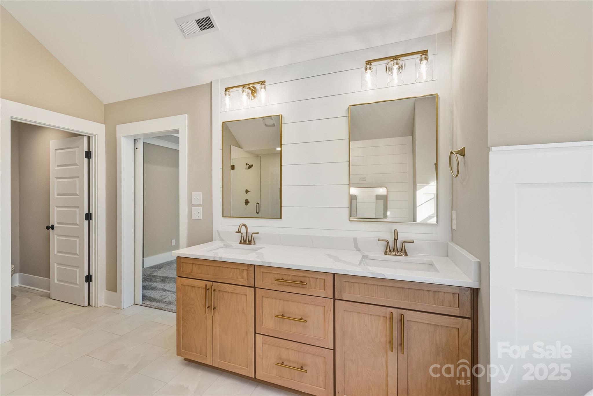 1913 Snyders Store Road, Unit 5 Wingate, NC 28174 - Photo 30 of 48 a bathroom with a double vanity sink mirror and