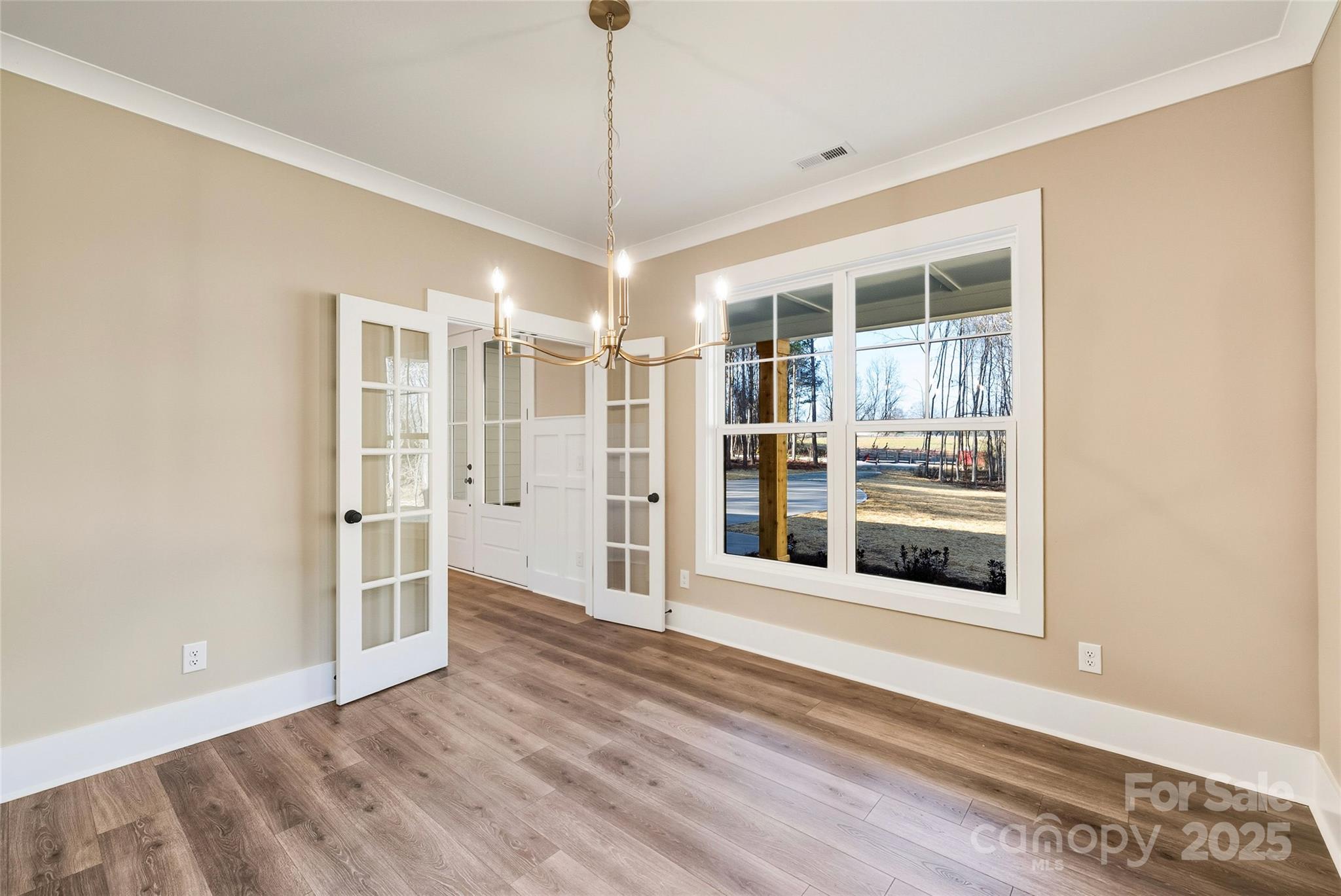 1913 Snyders Store Road, Unit 5 Wingate, NC 28174 - Photo 41 of 48 a view of a room with wooden floor and entryway