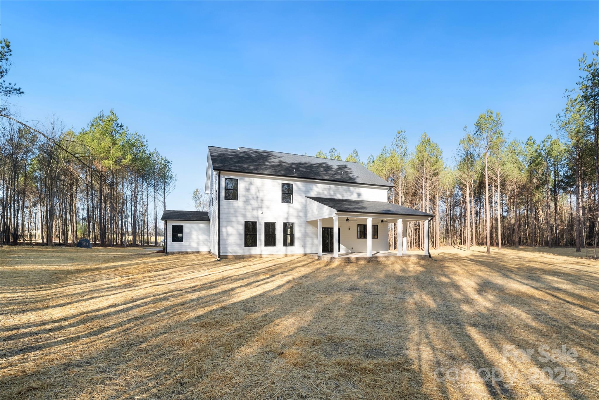 1913 Snyders Store Road, Unit 5 Wingate, NC 28174 - Photo 47 of 48 a front view of a building with a garden