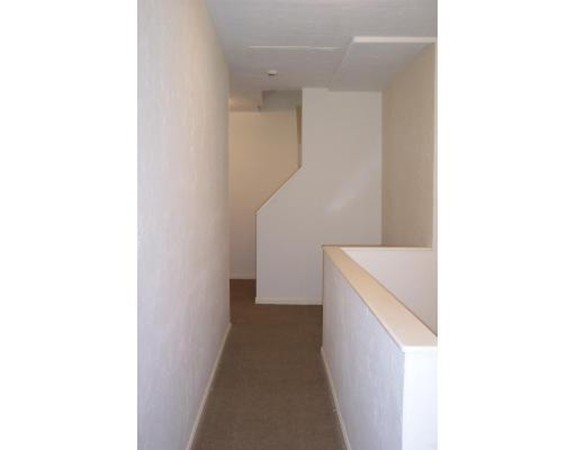 160 Cottage Street, Unit 302 Boston, MA 02128 - Photo 3 of 18 a view of a hallway with white walls