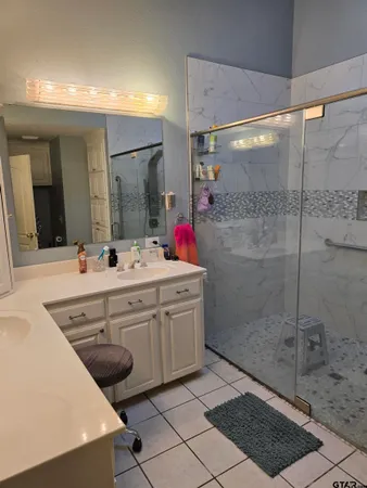 a bathroom with a sink toilet and mirror