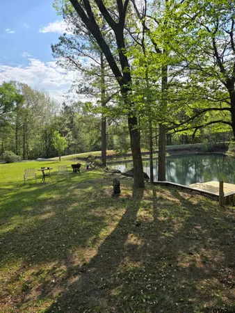 a balcony with wooden floor and outdoor seating