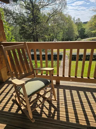 a living room with furniture a clock and a table