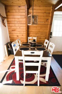 a view of a workspace with wooden floor