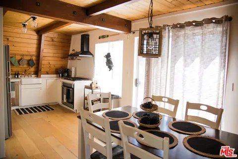 a kitchen with a refrigerator and a stove