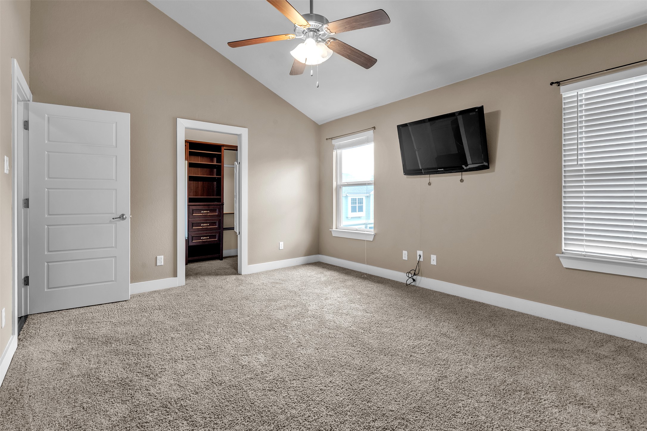 12212 Tawny Farms Road, Unit 142 Austin, TX 78748 - Photo 12 of 21 A restful bedroom offers vaulted ceilings and soft carpeting, perfect for quiet enjoyment.