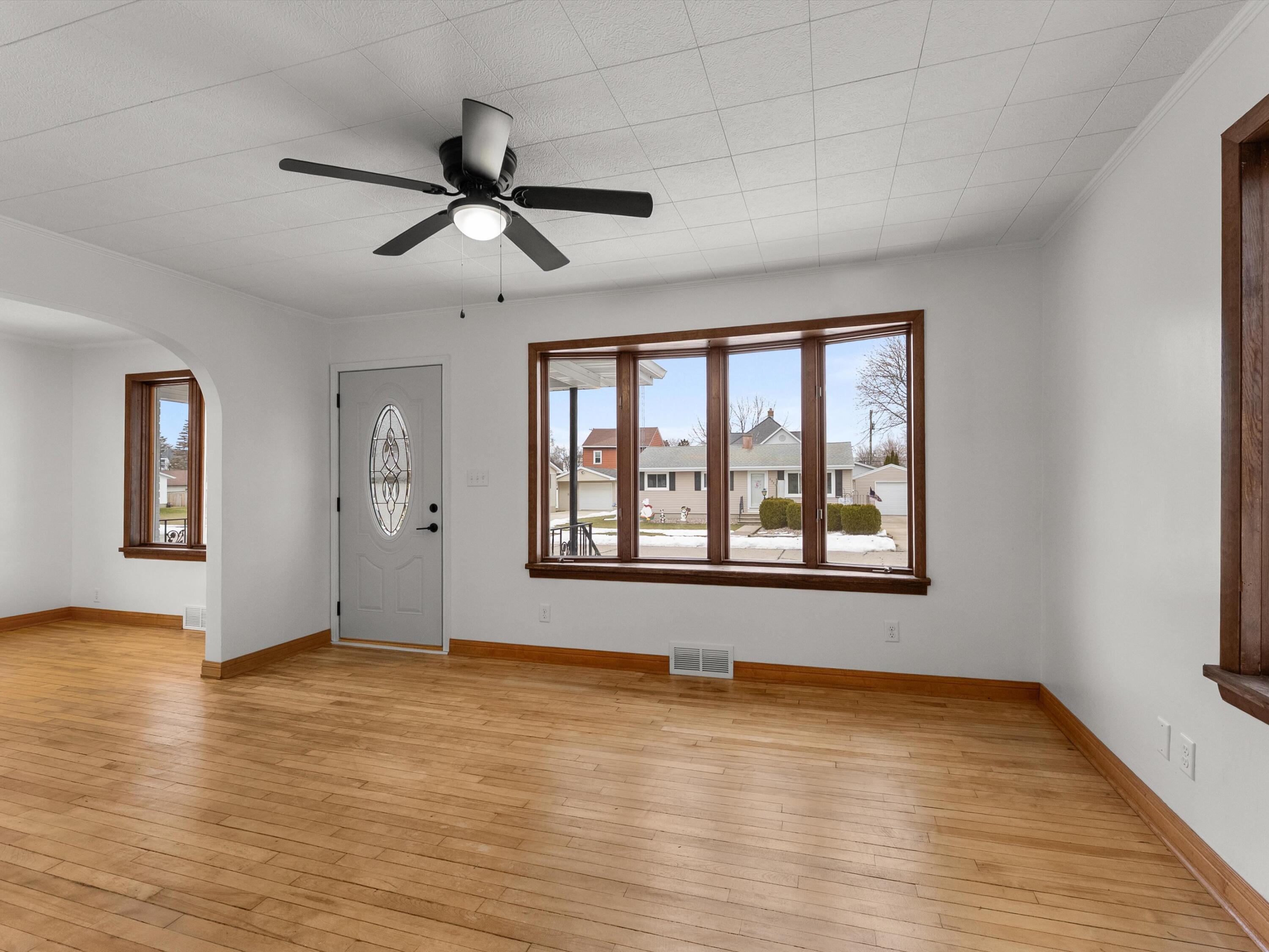 2323 9th Place Two Rivers, WI 54241 - Photo 7 of 35 Large living room with a ton of natural light