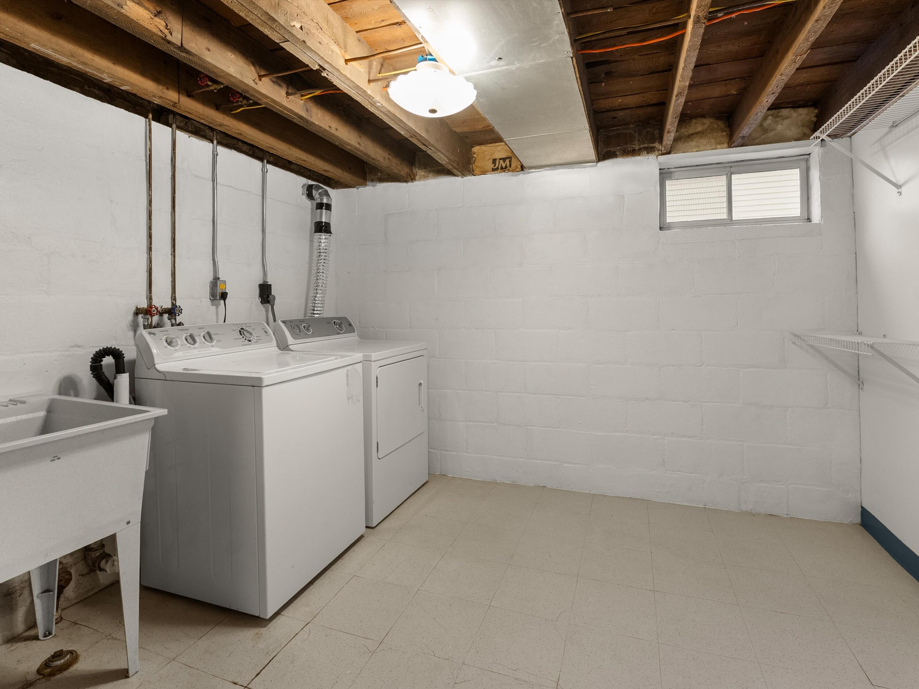 2323 9th Place Two Rivers, WI 54241 - Photo 24 of 35 Laundry room with wash bay lower