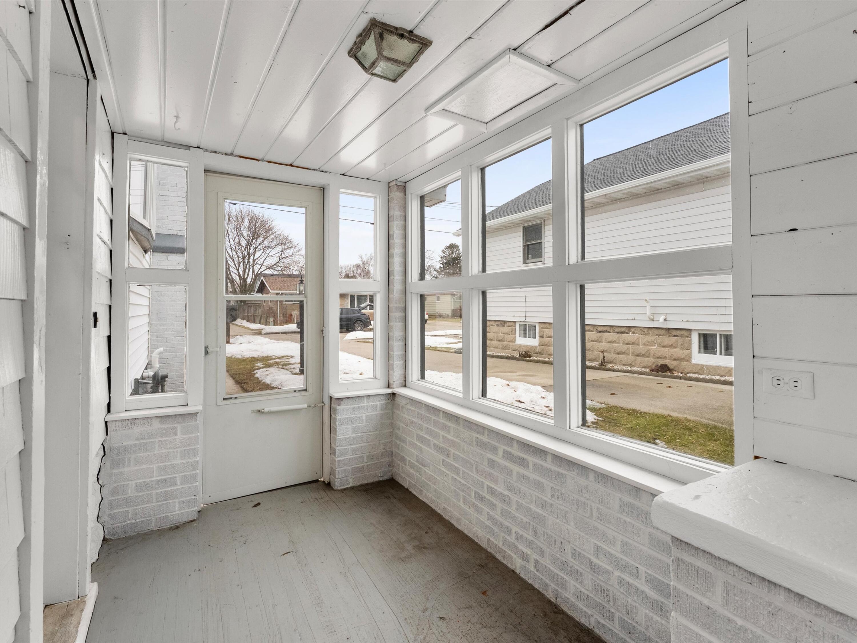2323 9th Place Two Rivers, WI 54241 - Photo 31 of 35 Nice breezeway or added 3 seasons room.