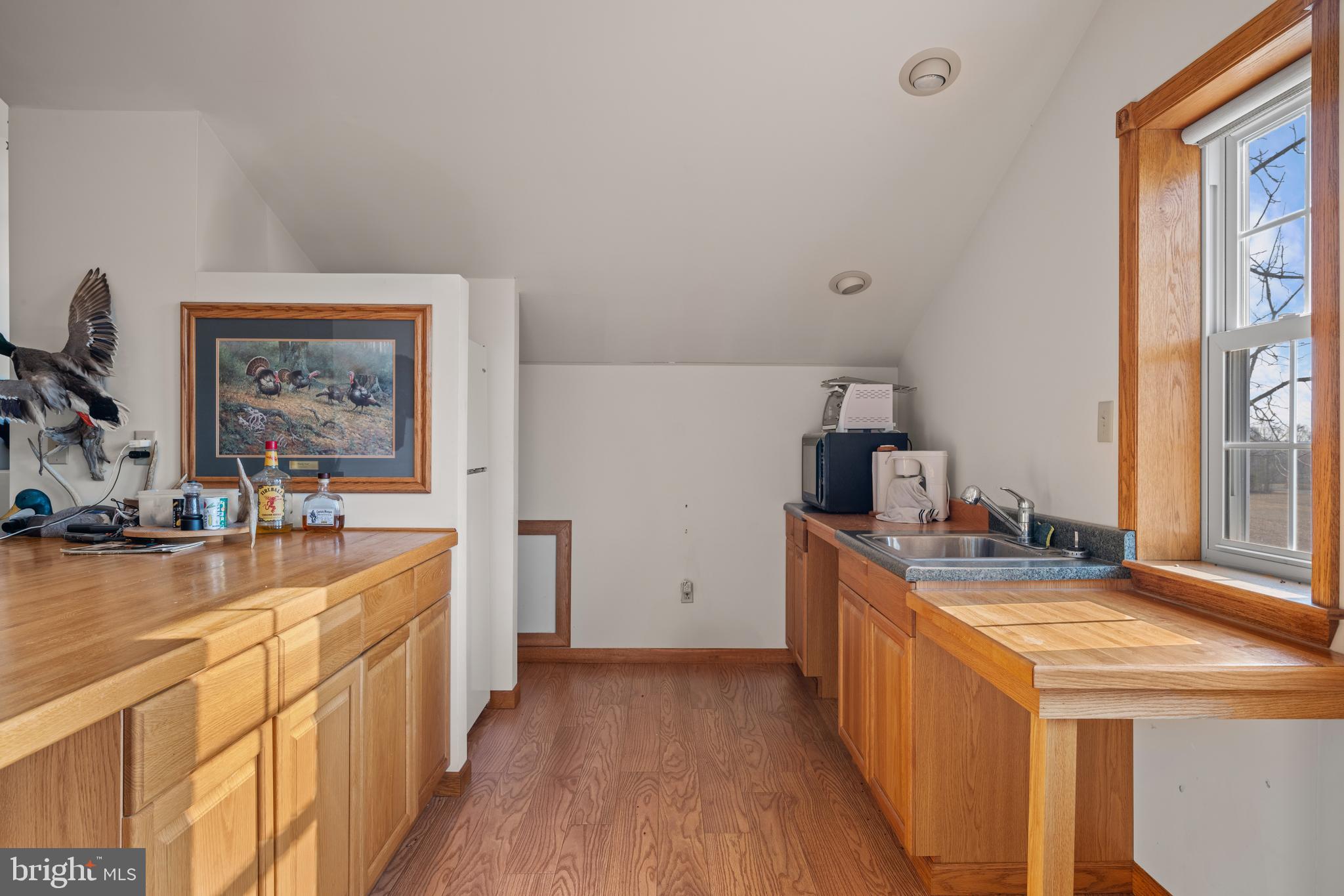 605 Gum Tree Corner Road Bridgeton, NJ 08302 - Photo 13 of 20 a kitchen with a stove a refrigerator a sink and dishwasher with wooden floor