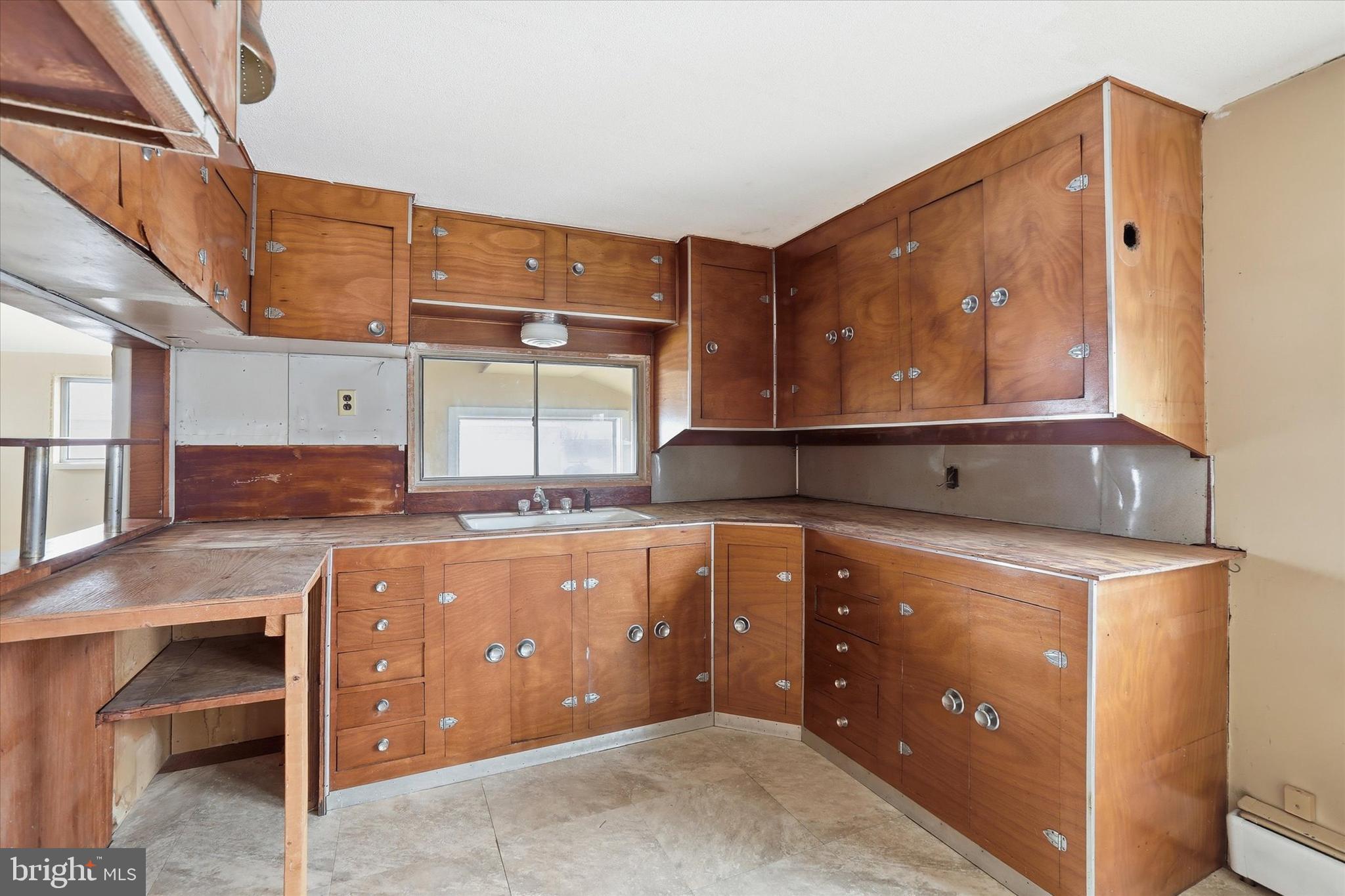 337 Main Street Tullytown, PA 19007 - Photo 19 of 33 a kitchen with a stove and a sink
