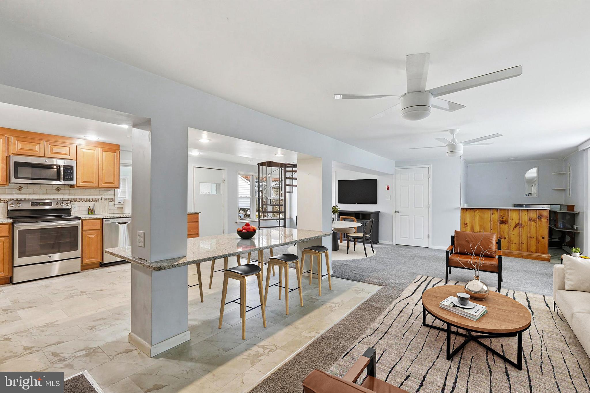 337 Main Street Tullytown, PA 19007 - Photo 3 of 33 a room with furniture a rug and a flat screen tv