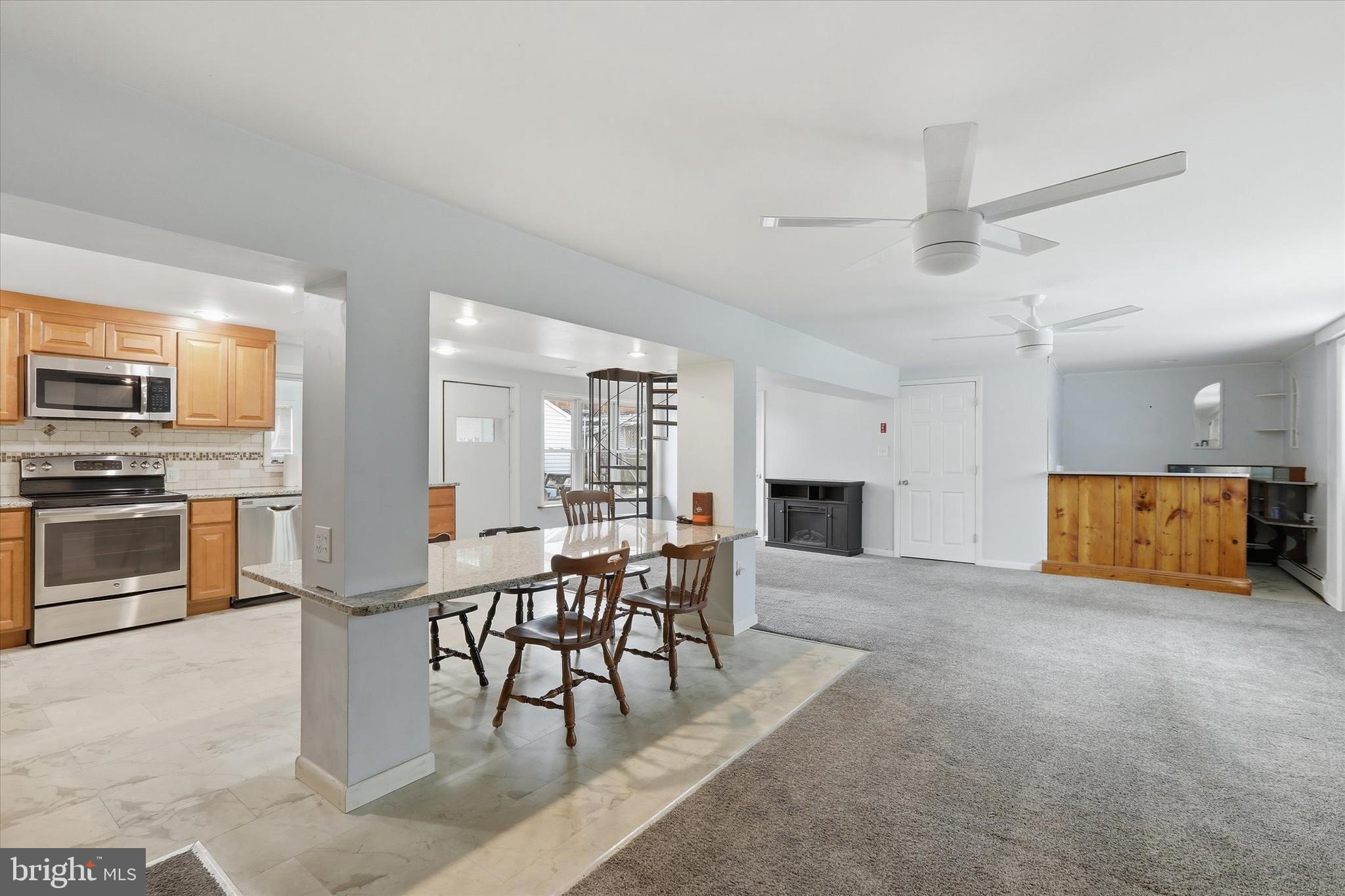 337 Main Street Tullytown, PA 19007 - Photo 5 of 33 a view of kitchen with furniture and a fireplace