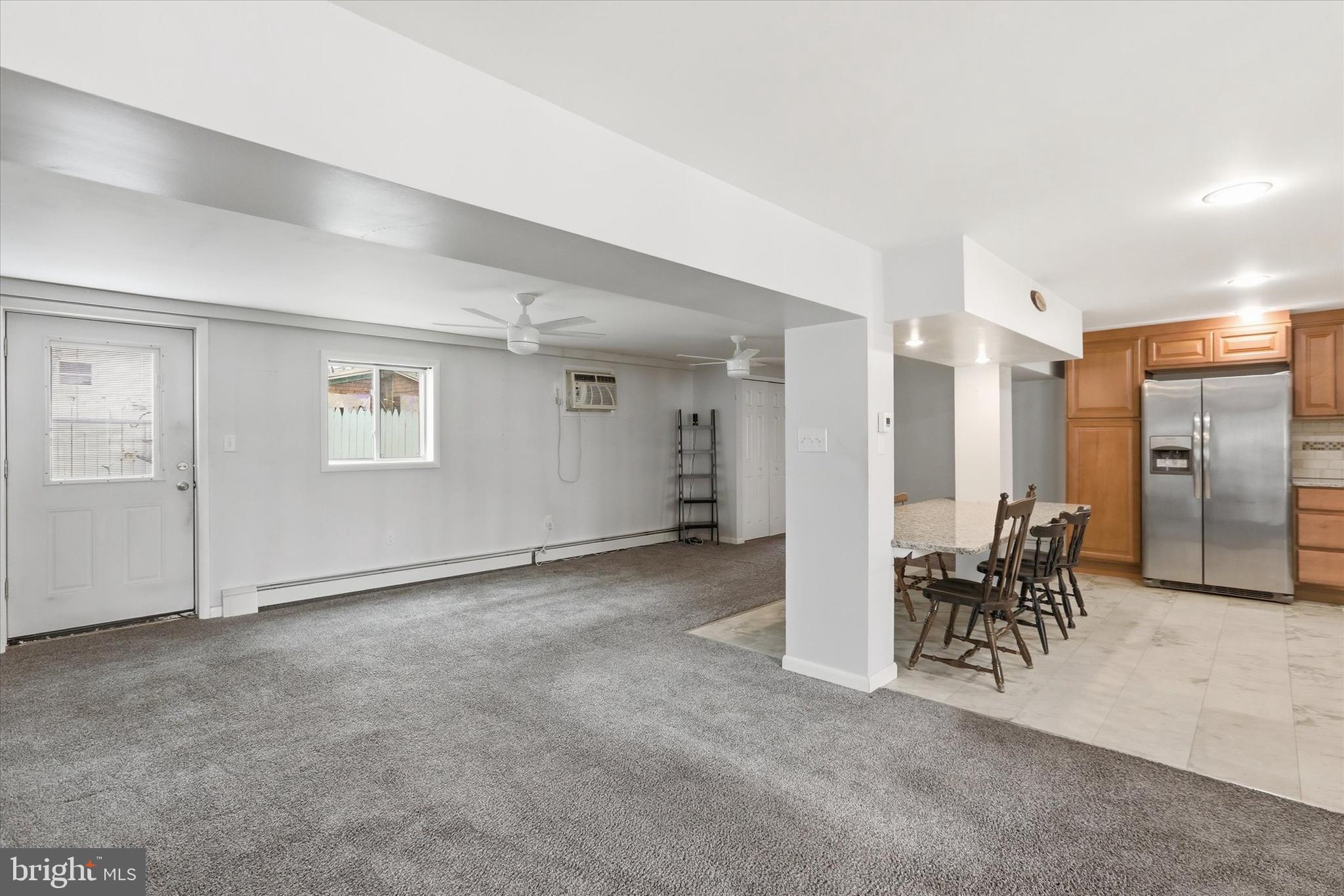 337 Main Street Tullytown, PA 19007 - Photo 7 of 33 a view of a livingroom with furniture and a refrigerator