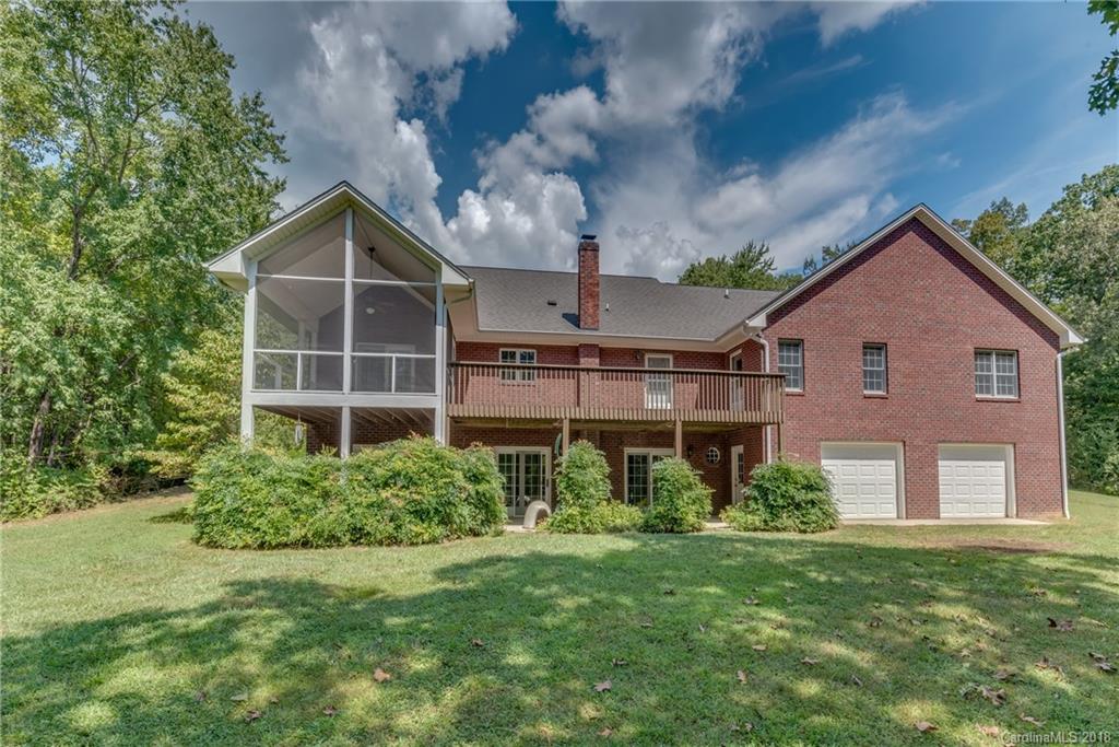 661 Henderson Road Tryon, NC 28782 - Photo 2 of 33 a view of a house with backyard