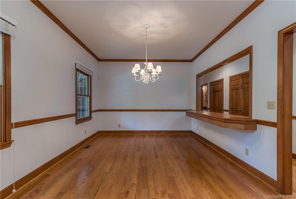 661 Henderson Road Tryon, NC 28782 - Photo 11 of 33 a view of empty room with wooden floor and fan