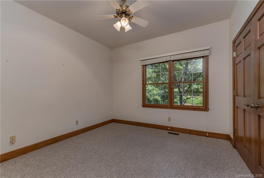 661 Henderson Road Tryon, NC 28782 - Photo 16 of 33 an empty room with a window