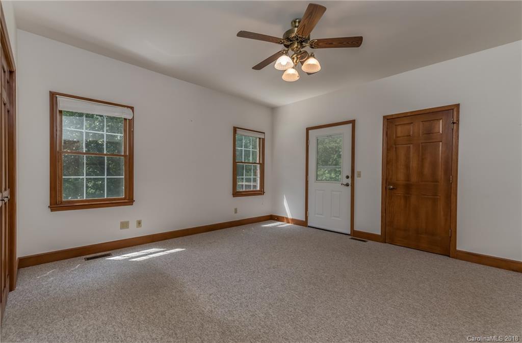661 Henderson Road Tryon, NC 28782 - Photo 17 of 33 a view of an empty room with windows