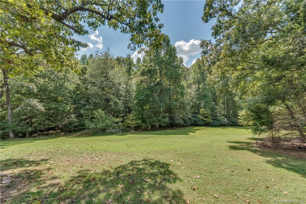 661 Henderson Road Tryon, NC 28782 - Photo 25 of 33 a view of a field with trees in background