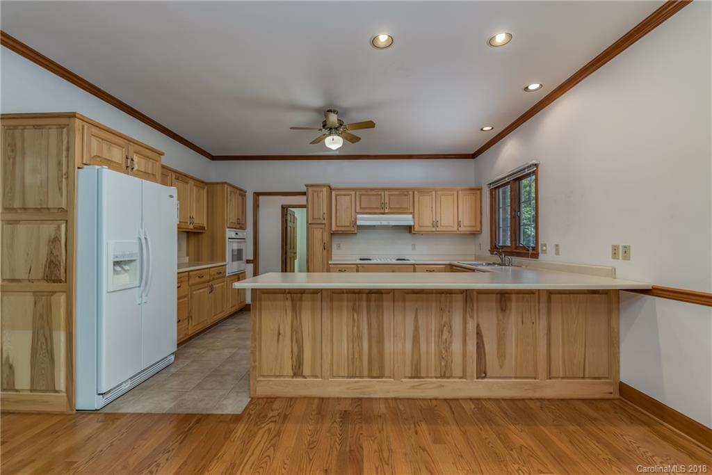 661 Henderson Road Tryon, NC 28782 - Photo 8 of 33 a view of a kitchen with a sink and refrigerator