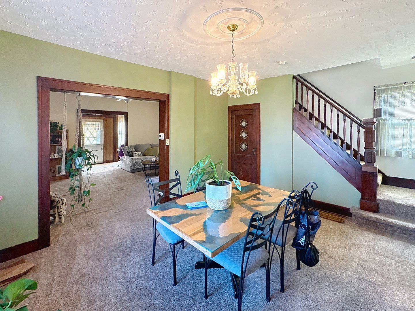 527 19th Avenue Moline, IL 61265 - Photo 6 of 22 a view of a dining room with furniture and a chandelier