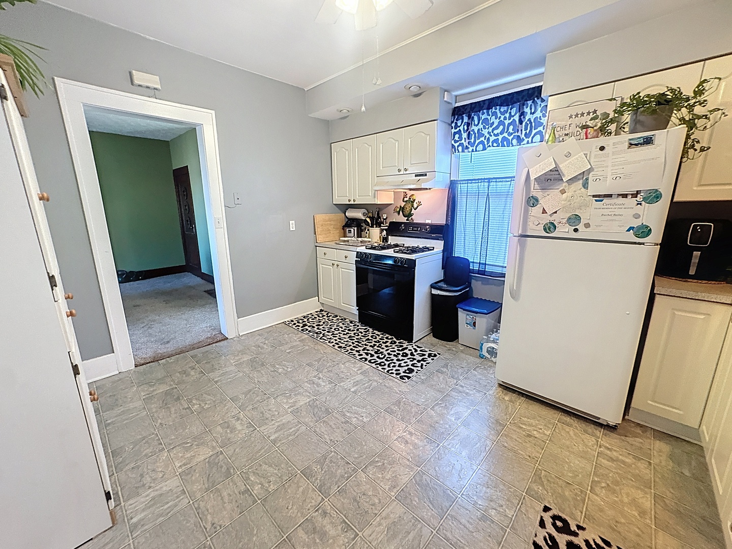 527 19th Avenue Moline, IL 61265 - Photo 9 of 22 a view of a kitchen with refrigerator and a stove