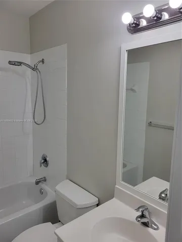 a bathroom with a bathtub and shower