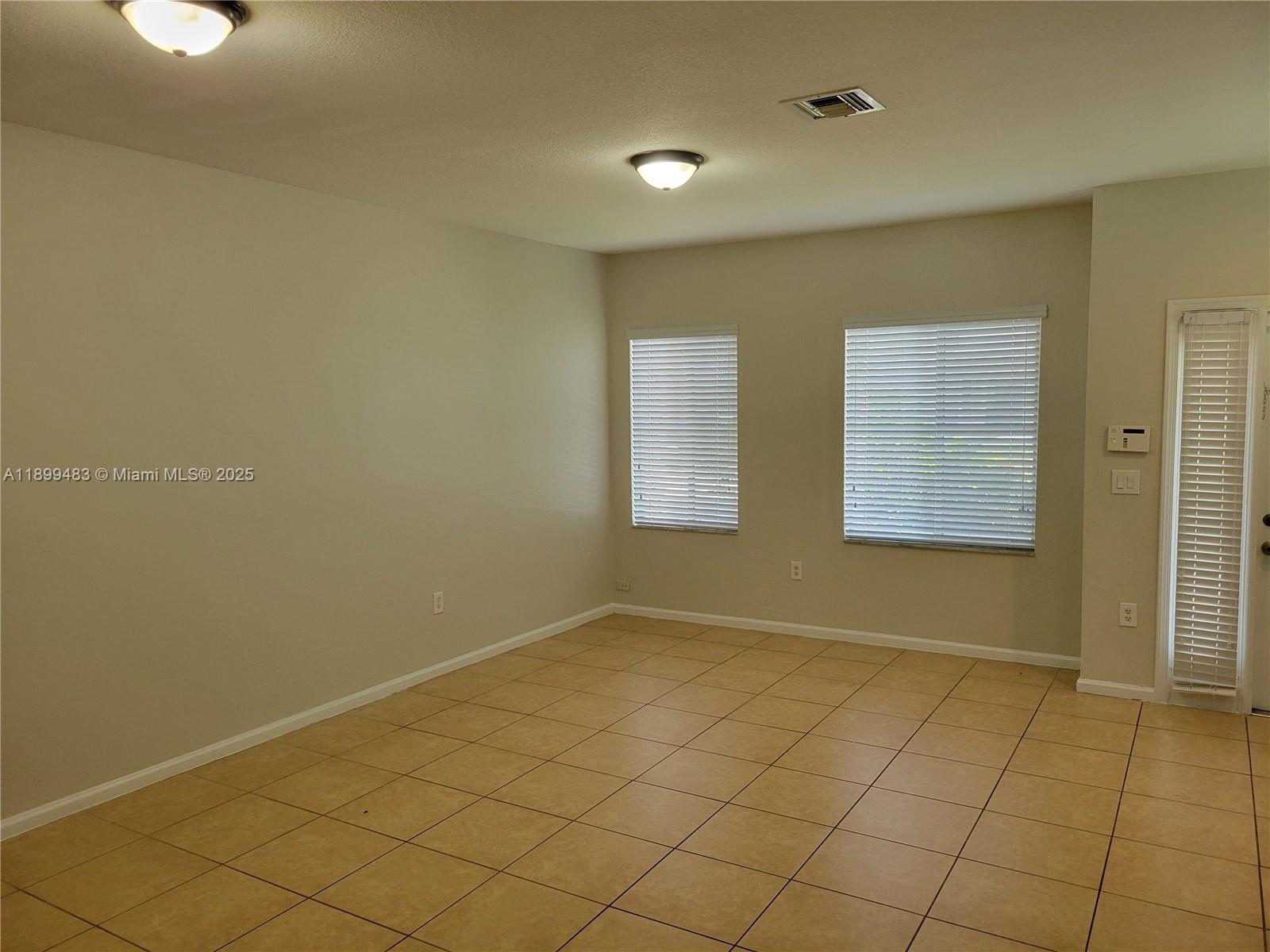 2556 Southwest 83rd Avenue, Unit 101 Miramar, FL 33025 - Photo 2 of 19 a view of room with window