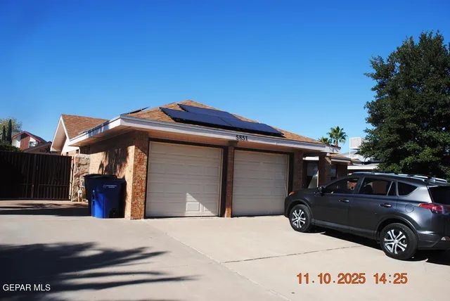 a front view of a house with parking