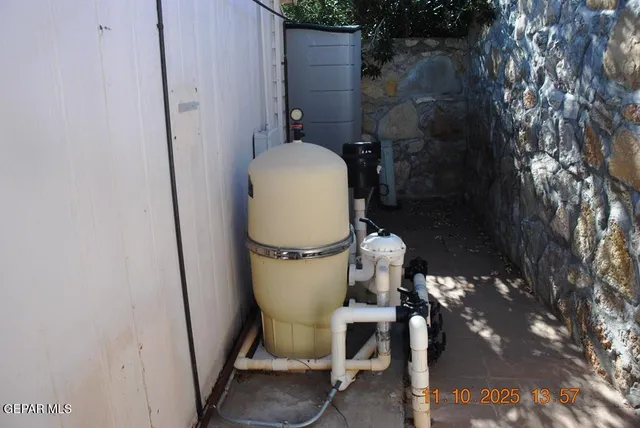 a bathroom with a toilet and a mirror