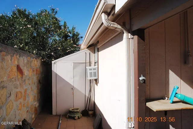 a front view of a house with outdoor seating