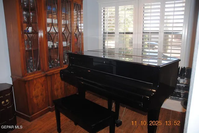 a black leather chair sitting in a room next to a window