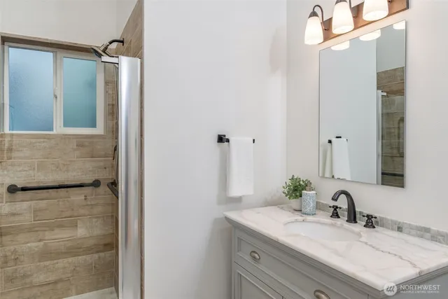 a bedroom with a bed and a couch