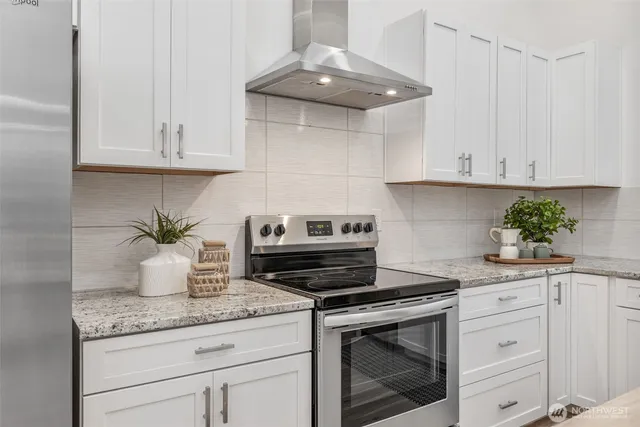 a view of a dining room with furniture wooden floor and chandelier