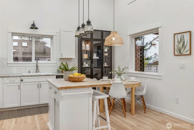 a view of a dining room with furniture and chandelier