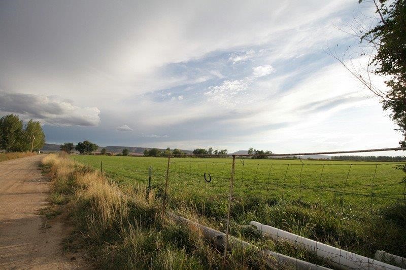 1075 Q Road Mack, CO 81525 - Photo 15 of 17 a view of a lake with a big yard