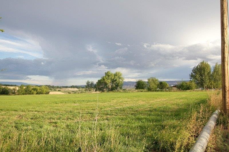 1075 Q Road Mack, CO 81525 - Photo 16 of 17 a view of an ocean and a yard