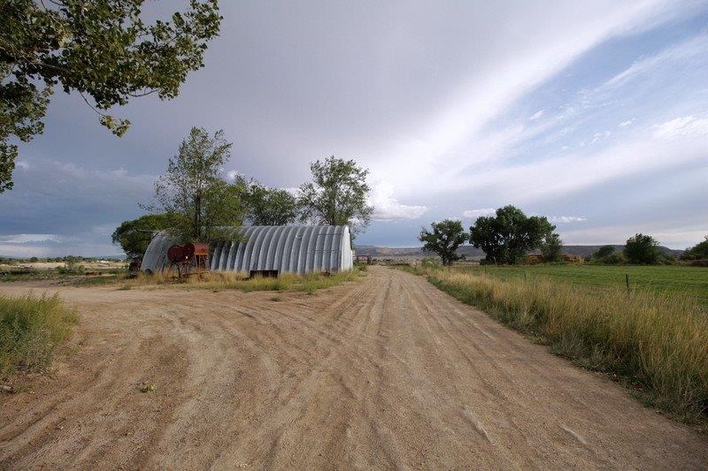 1075 Q Road Mack, CO 81525 - Photo 3 of 17 a view of a lake from a yard