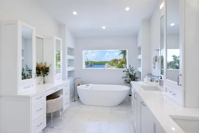 a bathroom with a shower sink and mirror