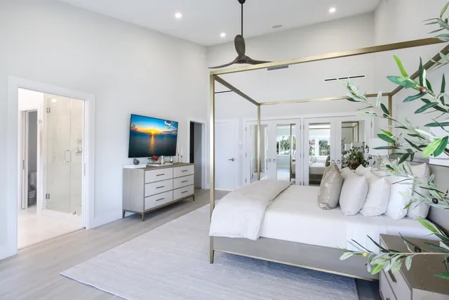 a bedroom with a bed couch and window