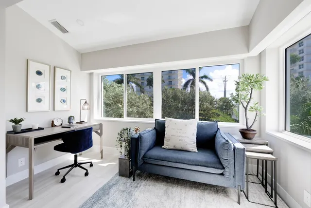 a bathroom with a sink a potted plant and a bathtub