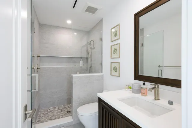 a view of multiple houses with a lake