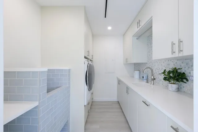 a front view of a house with a yard and a garage