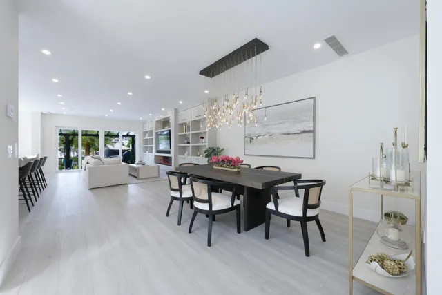 a large kitchen with a table and chairs
