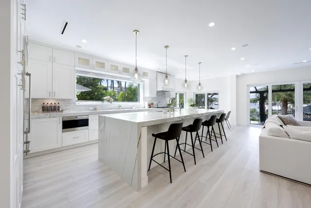 a bedroom with furniture and a potted plant