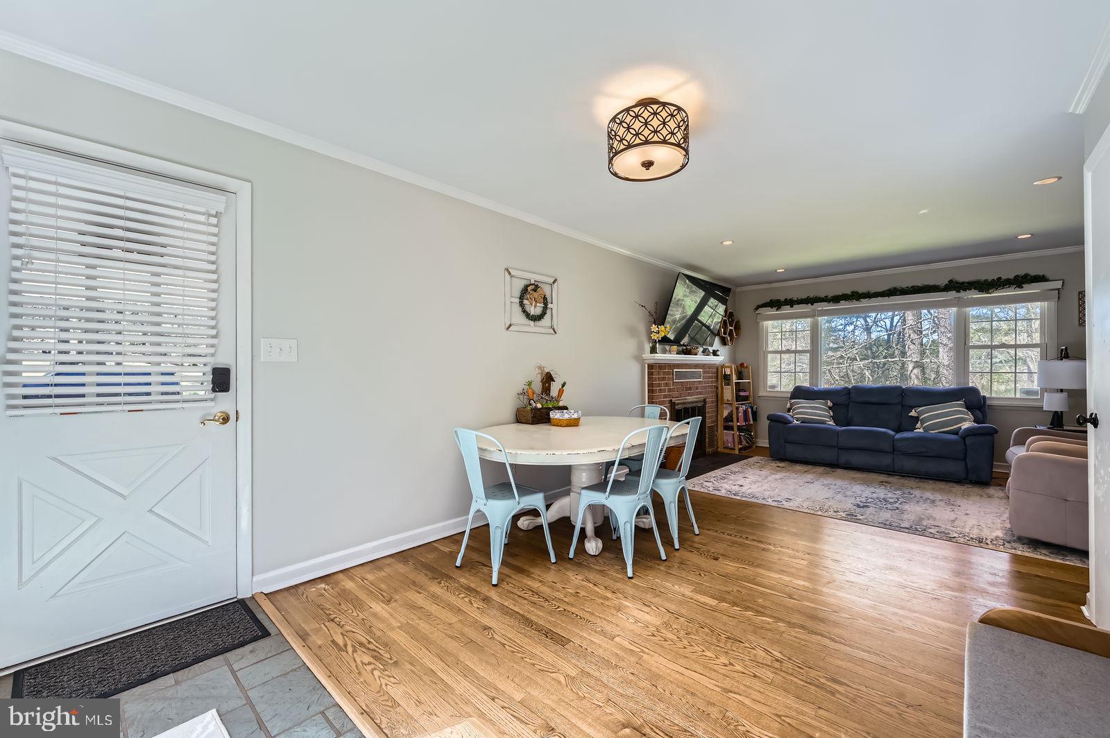 14629 Hanover Pike Upperco, MD 21155 - Photo 11 of 38 a dining room with wooden floor and a table