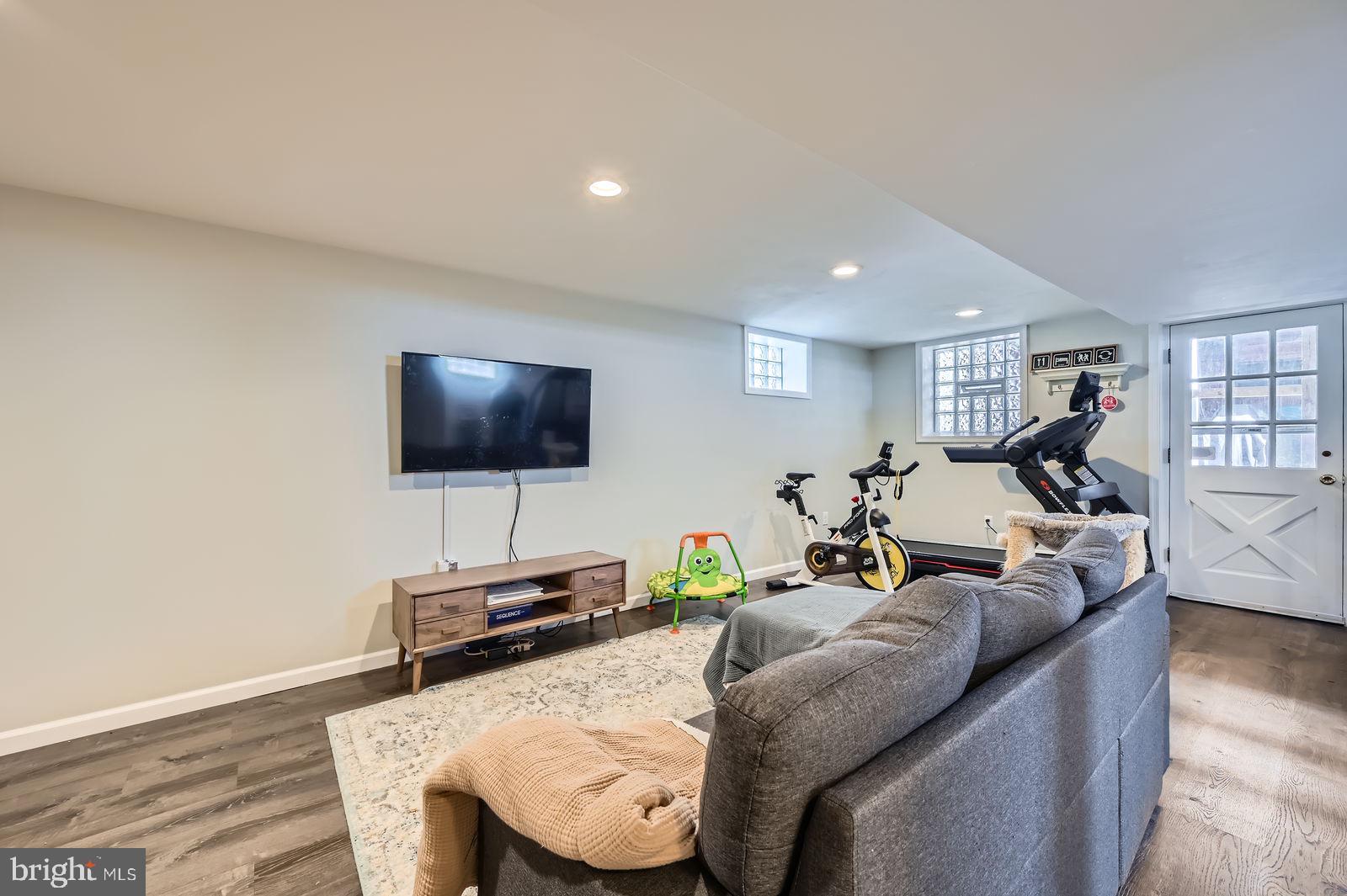 14629 Hanover Pike Upperco, MD 21155 - Photo 22 of 38 a living room with furniture and a flat screen tv