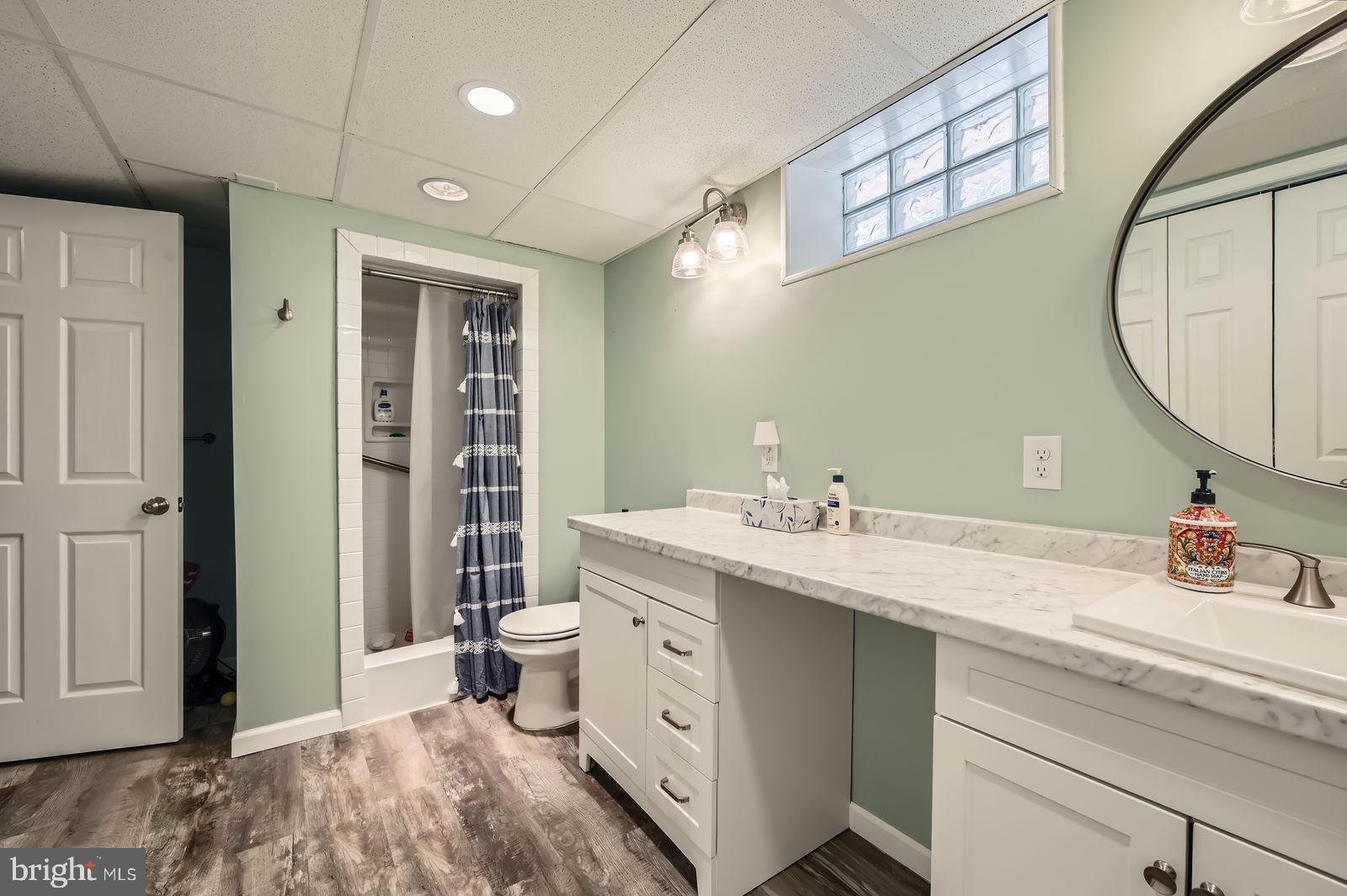 14629 Hanover Pike Upperco, MD 21155 - Photo 23 of 38 a bathroom with a sink a toilet and a mirror