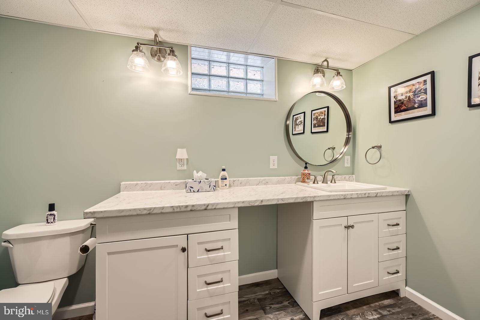 14629 Hanover Pike Upperco, MD 21155 - Photo 24 of 38 a bathroom with a toilet sink and mirror