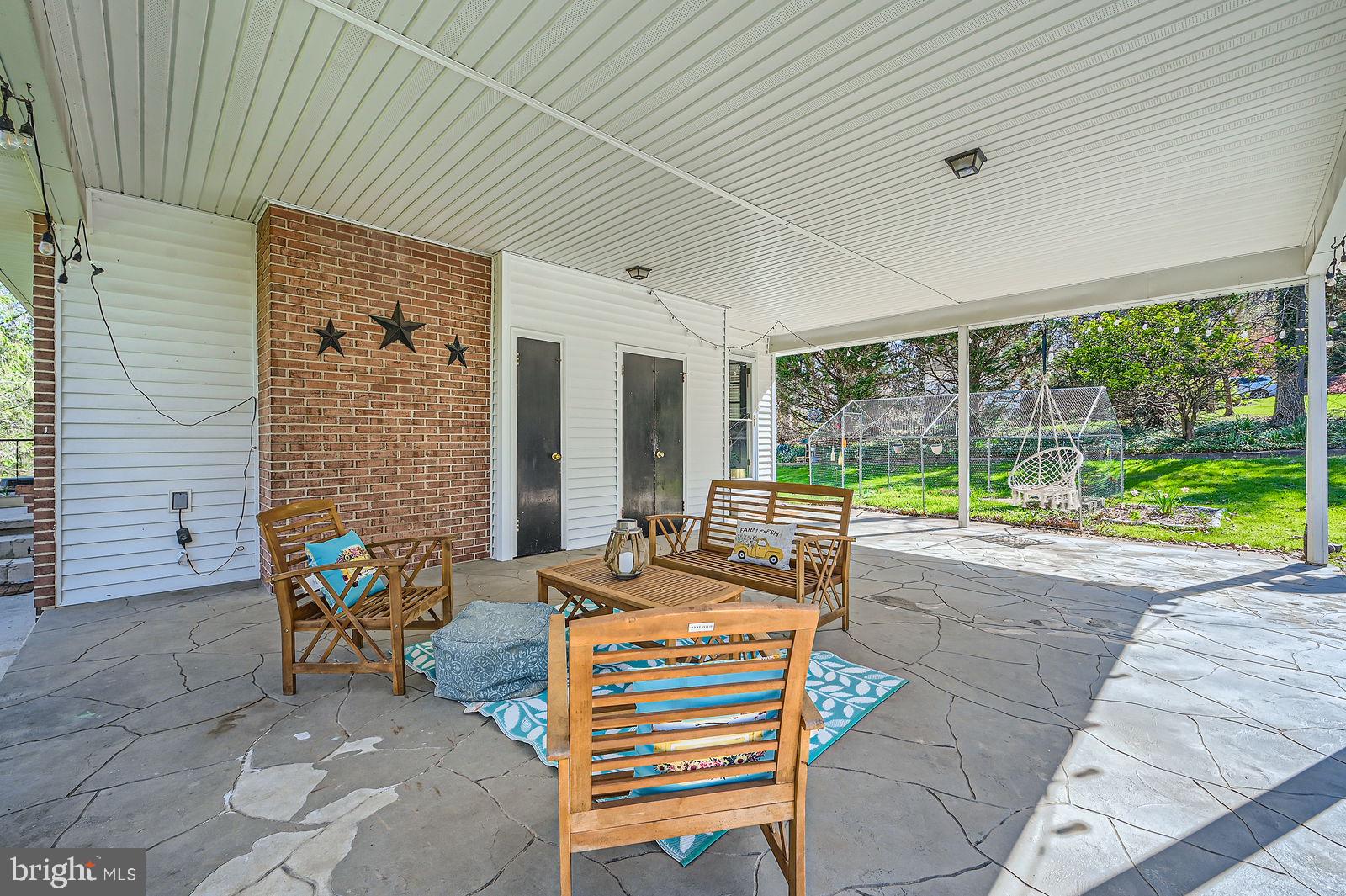 14629 Hanover Pike Upperco, MD 21155 - Photo 28 of 38 a building outdoor space with patio furniture and garden